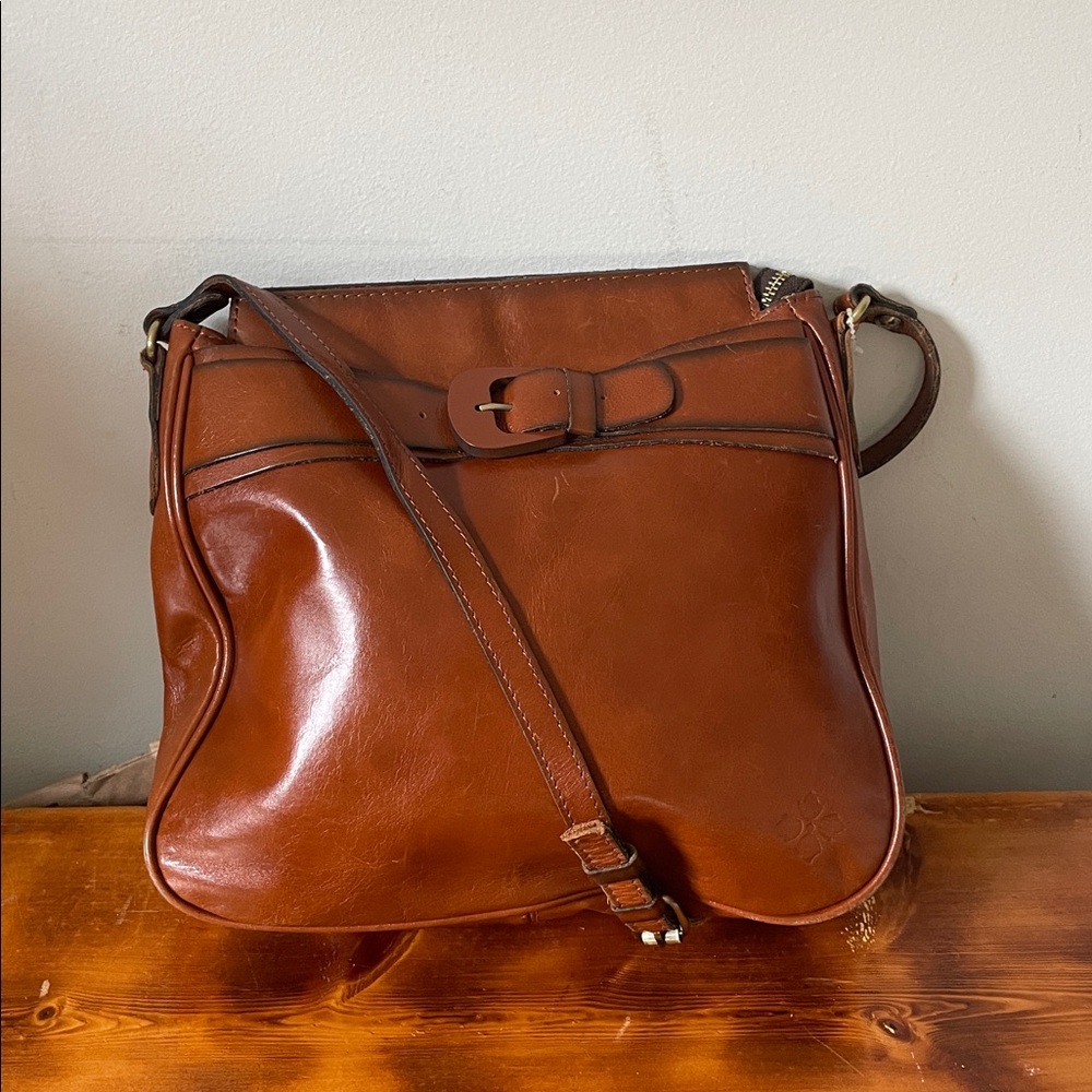Patricia Nash leather saddle crossbody bag cognac color distinctive buckle